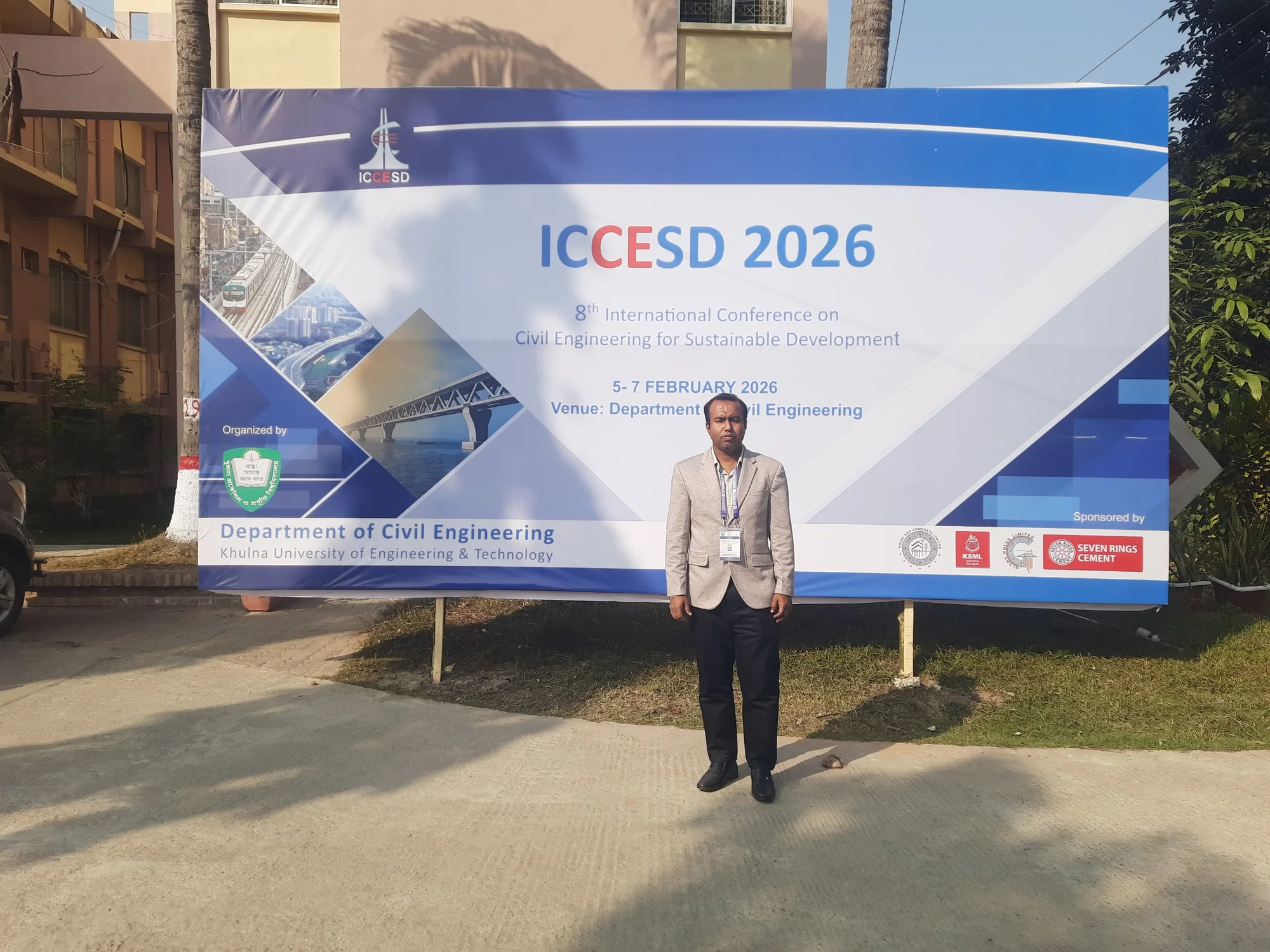 Engr. Munir Hossain Patoary standing in front of the ICCESD 2026 conference banner